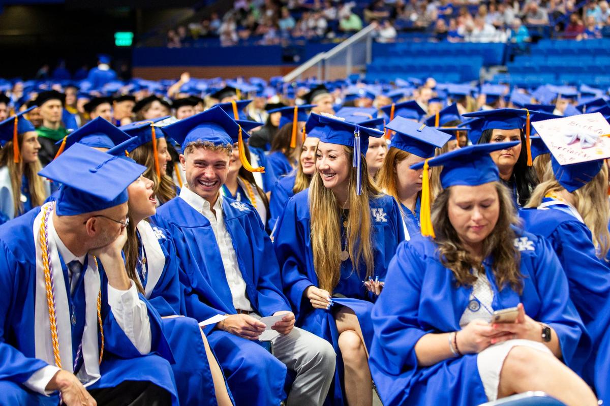 Graduates talk before the University of Kentucky Commencement Ceremony at Rupp Arena in Lexington, Ky., on Saturday, May 4, 2024.
