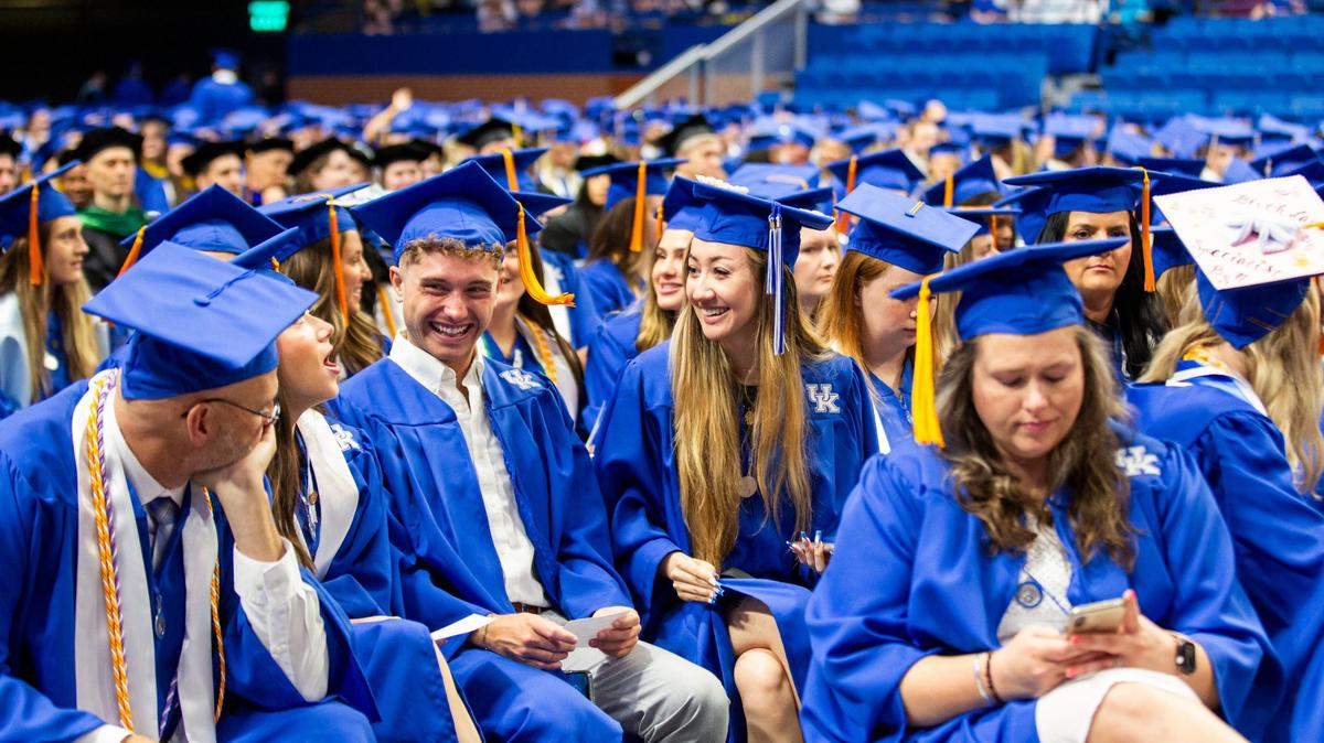 Graduates talk before the University of Kentucky Commencement Ceremony at Rupp Arena in Lexington, Ky., on Saturday, May 4, 2024.