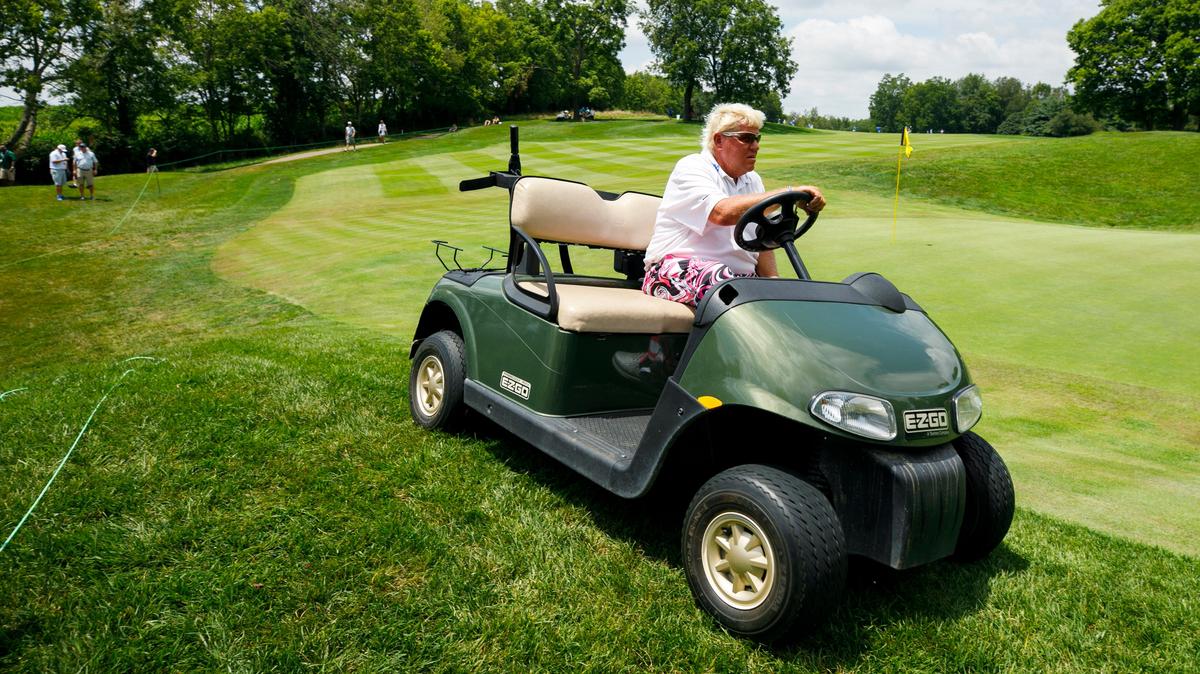 John Daly used a golf cart to navigate around the 16th green during the PGA Barbasol Championship opening round at Keene Trace Golf Club’s Champions Course in Nicholasville, Ky., Thursday, July 18, 2019.