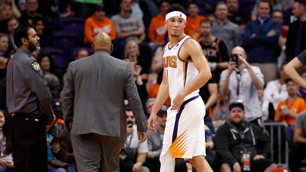 Phoenix Suns guard Devin Booker (1) left the game after being ejected during the second half against the Minnesota Timberwolves, Tuesday. Booker and Minnesota center Gorgui Dieng continued to exchange words as they exited opposite tunnels.