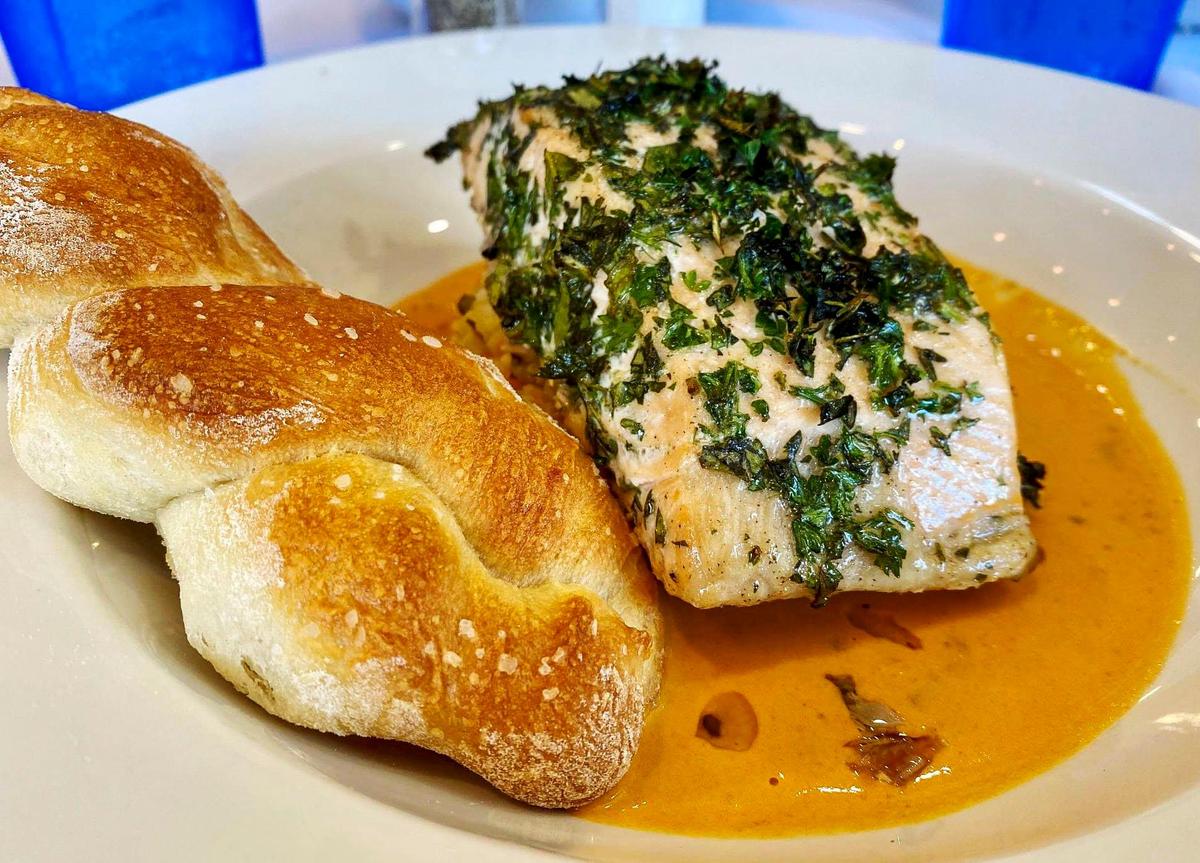 Salmon and tomato cream sauce with basmati rice pilaf and a twisted roll, Jan. 19, 2022 at The Lemon Tree.