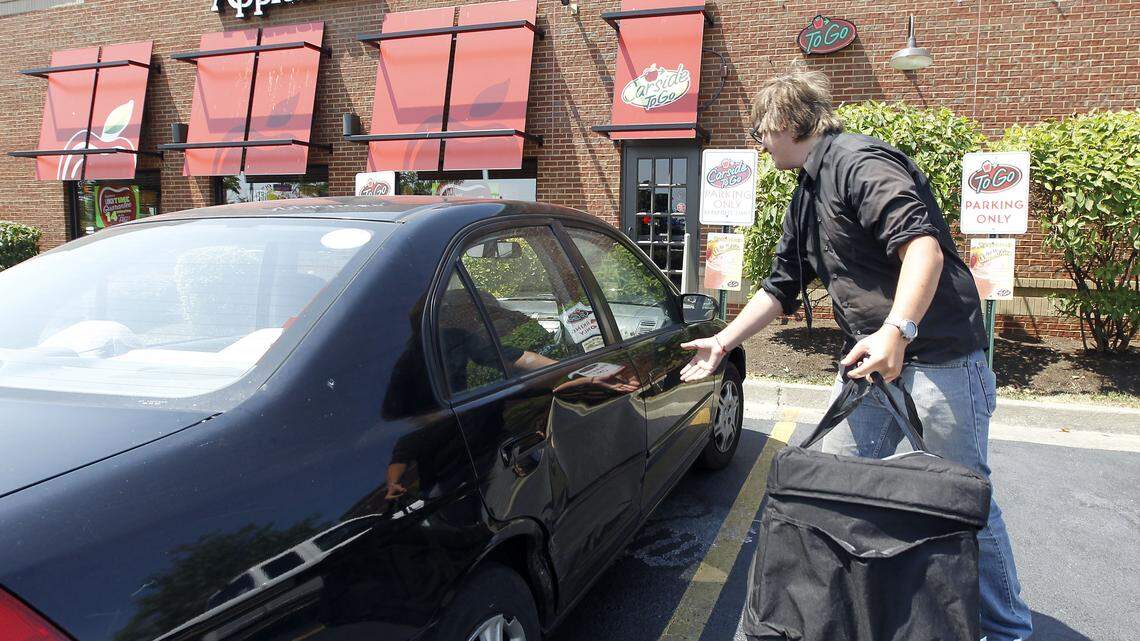 Brice Catlett, a delivery driver for LexEatIn, picked up a delivery order at Applebee's in Hamburg. Two partners started LexEatIn in October.  