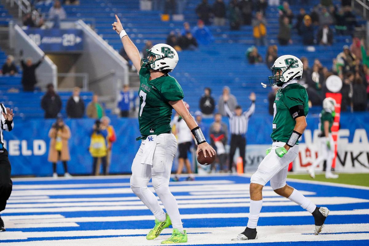 Owensboro Catholic quarterback Brady Atwell (7) passed for 514 yards and three touchdowns and rushed for 45 yards and four touchdowns on Friday night but his Aces came up one score short against Mayfield.