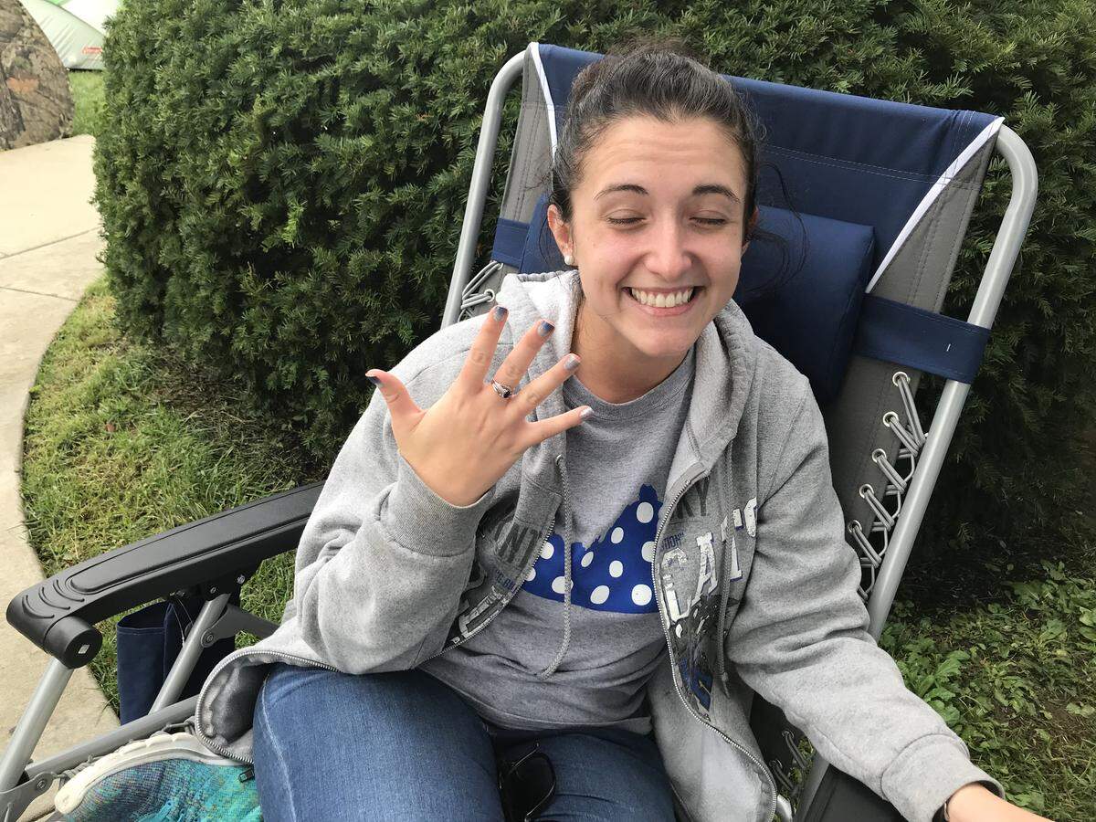 Kati Defevers flashed the sapphire birth stone ring her husband gave her. She camped out for Madness tickets on her 27th birthday Wednesday.