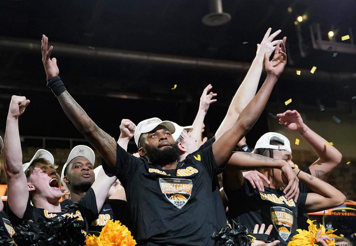 Northern Kentucky guard Trevon Faulkner celebrates with his teammates after they defeated Cleveland State in the Horizon League Tournament finals in Indianapolis.