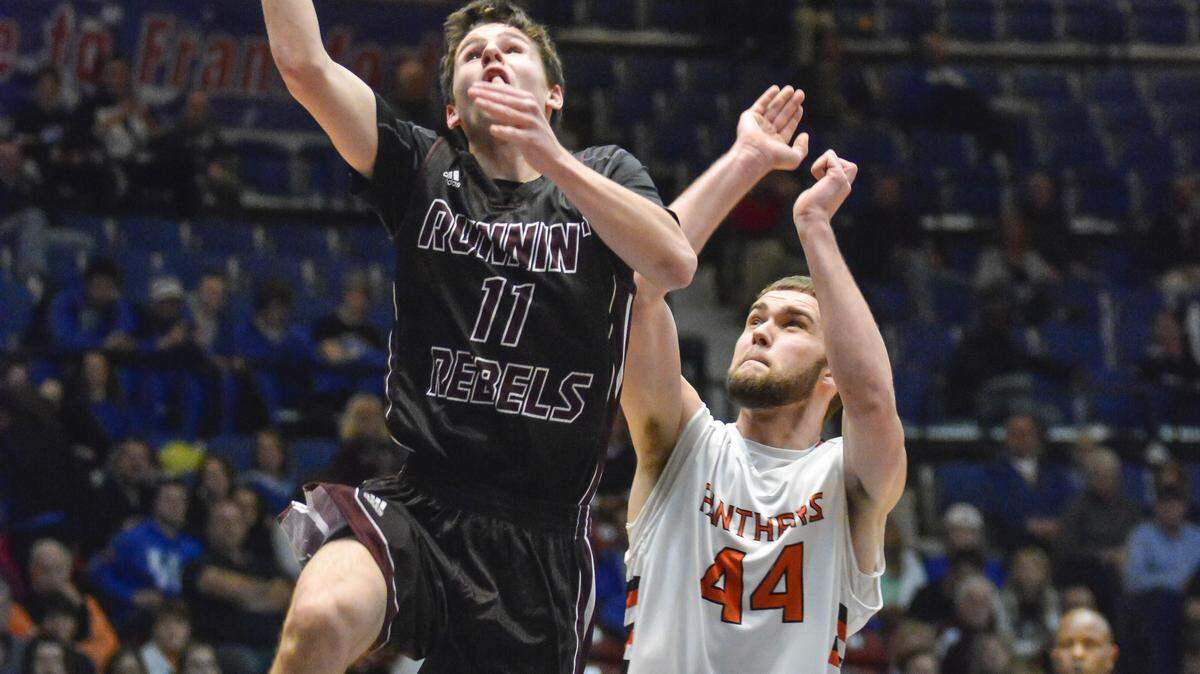 Owen County's Vince Toftness, left, scored over Augusta's Camryn Snapp during Thursday's opening round of the boys Touchstone Energy All-A Classic in Frankfort.      