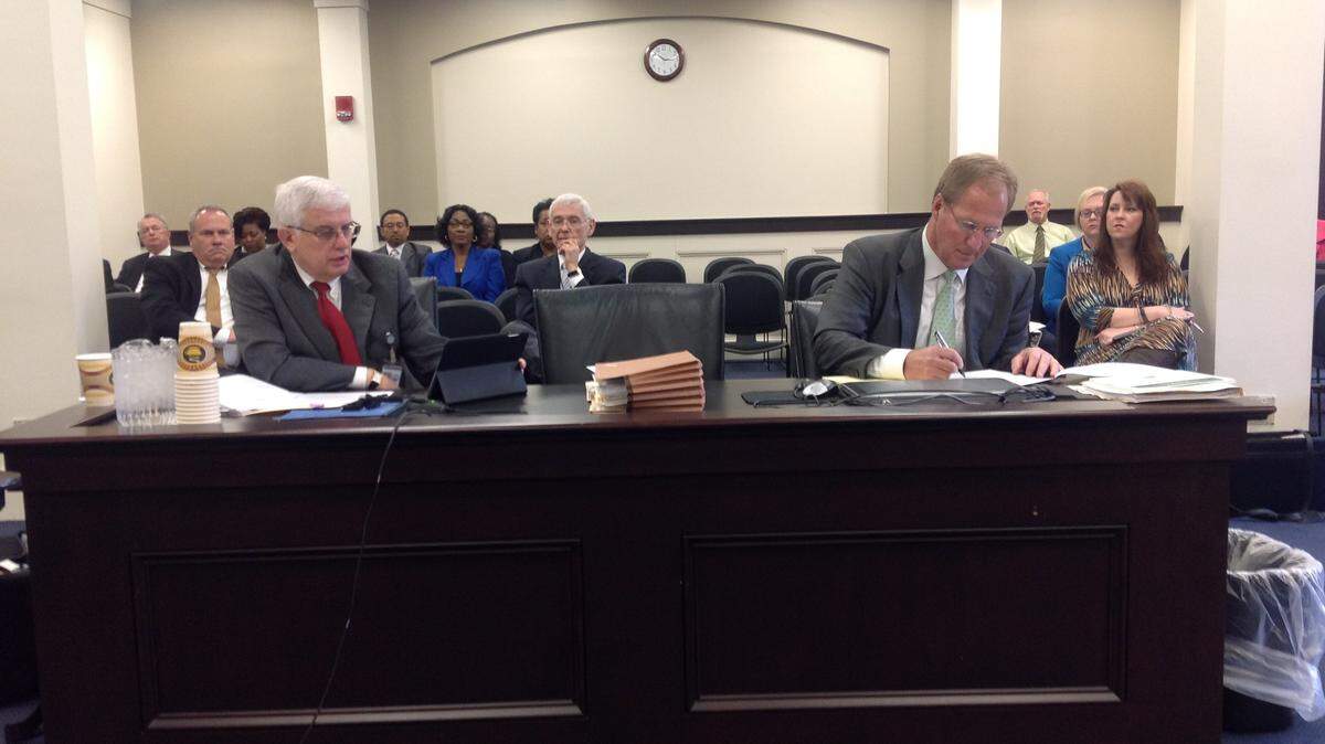 Legislative Ethics Commission enforcement counsel Mike Malone, left, and Steven Downey, attorney for former state Rep. John Arnold, disagree on whether commission has authority to consider ethics charges against Arnold.