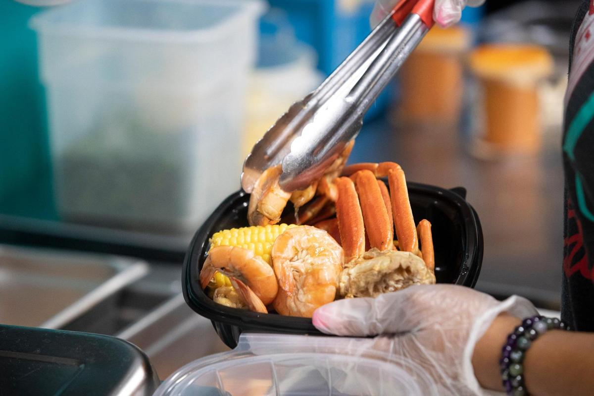A serving of the snowcrab boil at Seafood Lady at 833 Georgetown Street in Lexington, Ky., on Thursday, Aug. 28, 2020. The carryout restaurant features Cajun-style seafood boils with lobster, oysters, crabs, shrimp, fish, Southern seafood, plus po’boys and more.
