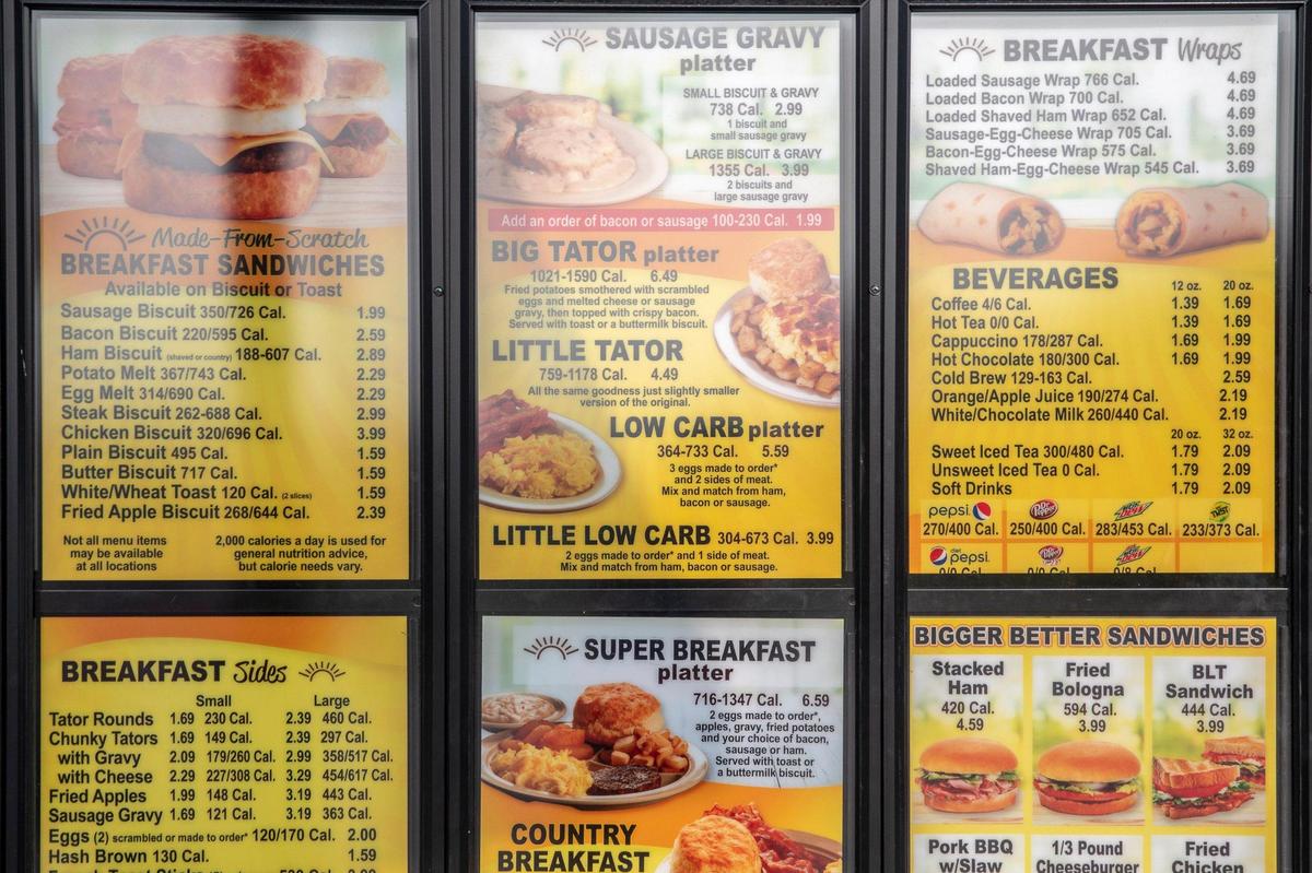 The menu board for the Tudor’s Biscuit World has breakfast and lunch items.