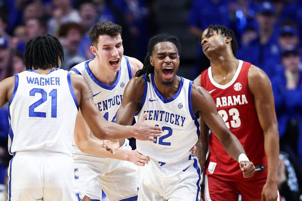 Kentucky Wildcats guard Antonio Reeves (12) celebrates with guard D.J. Wagner (21) after forcing a turnover against Alabama Crimson Tide forward Nick Pringle (23) during the game at Rupp Arena in Lexington, KY, Saturday, February 24, 2024.
