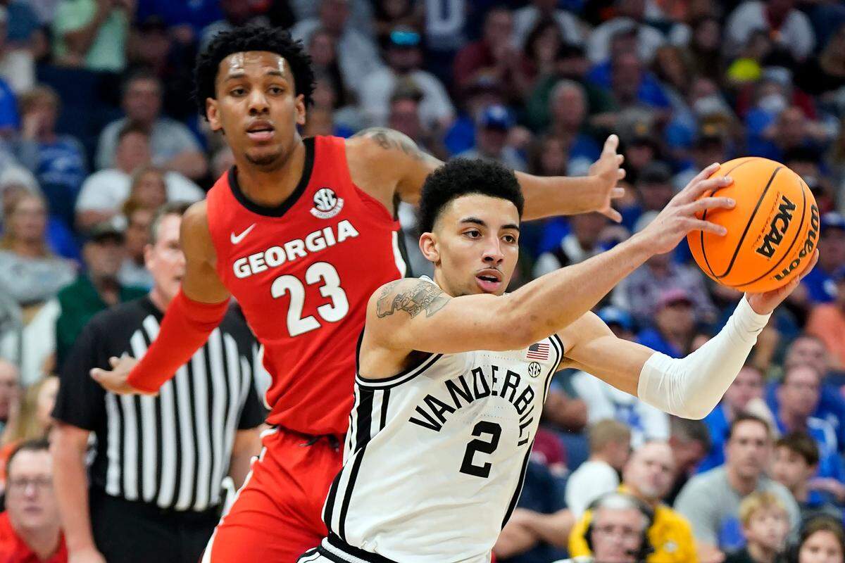 Vanderbilt’s Scotty Pippen Jr. (2) drives past Georgia’s Braelen Bridges (23) during their SEC Tournament game Wednesday night in Tampa. Vanderbilt advanced to play Alabama on Thursday. The winner of that game will face Kentucky in Friday’s quarterfinals.