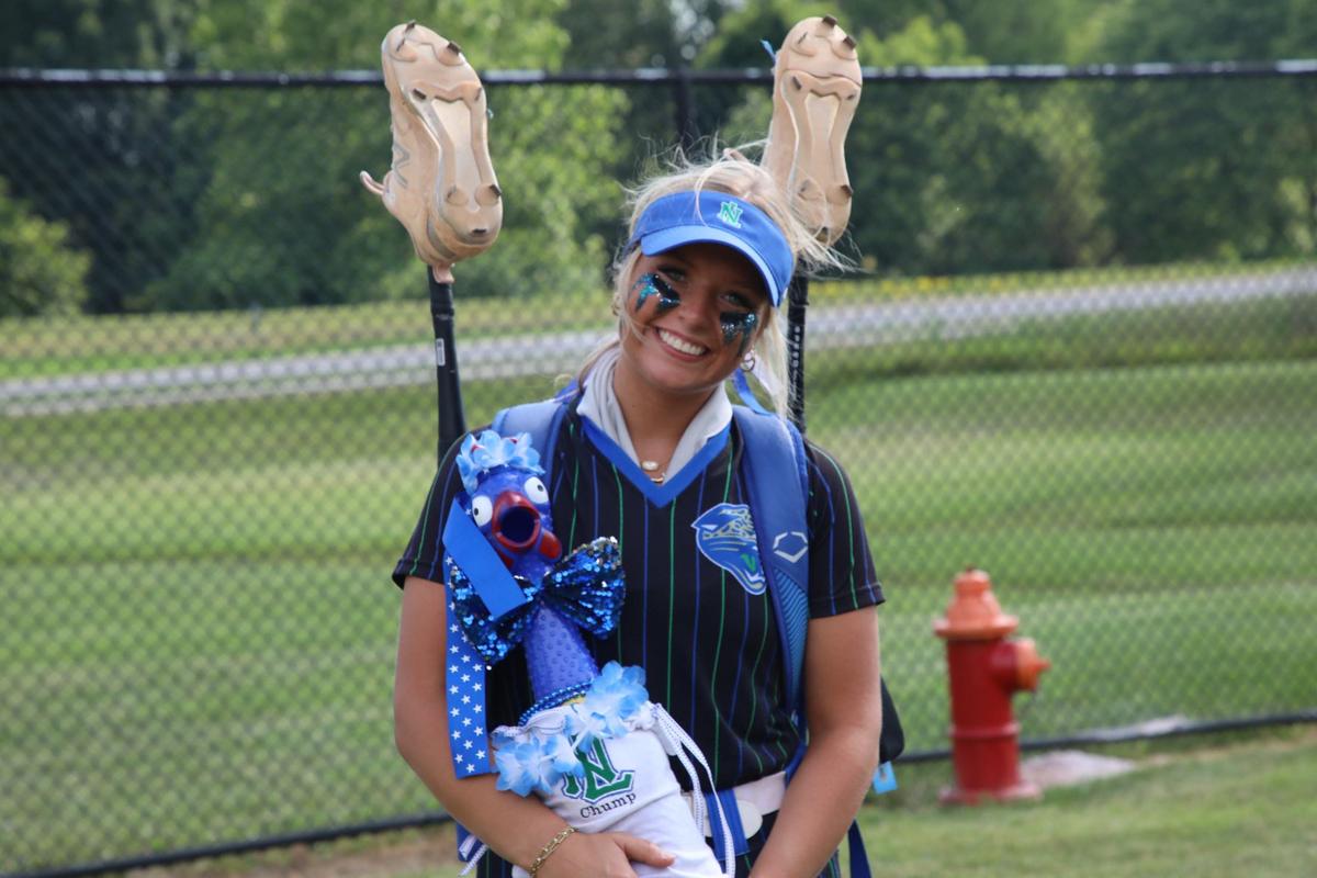 North Laurel’s Bella Sizemore shows off ‘Chump,’ the Lady Jaguars’ lucky charm, after her team’s win against Assumption in the state softball semifinals.