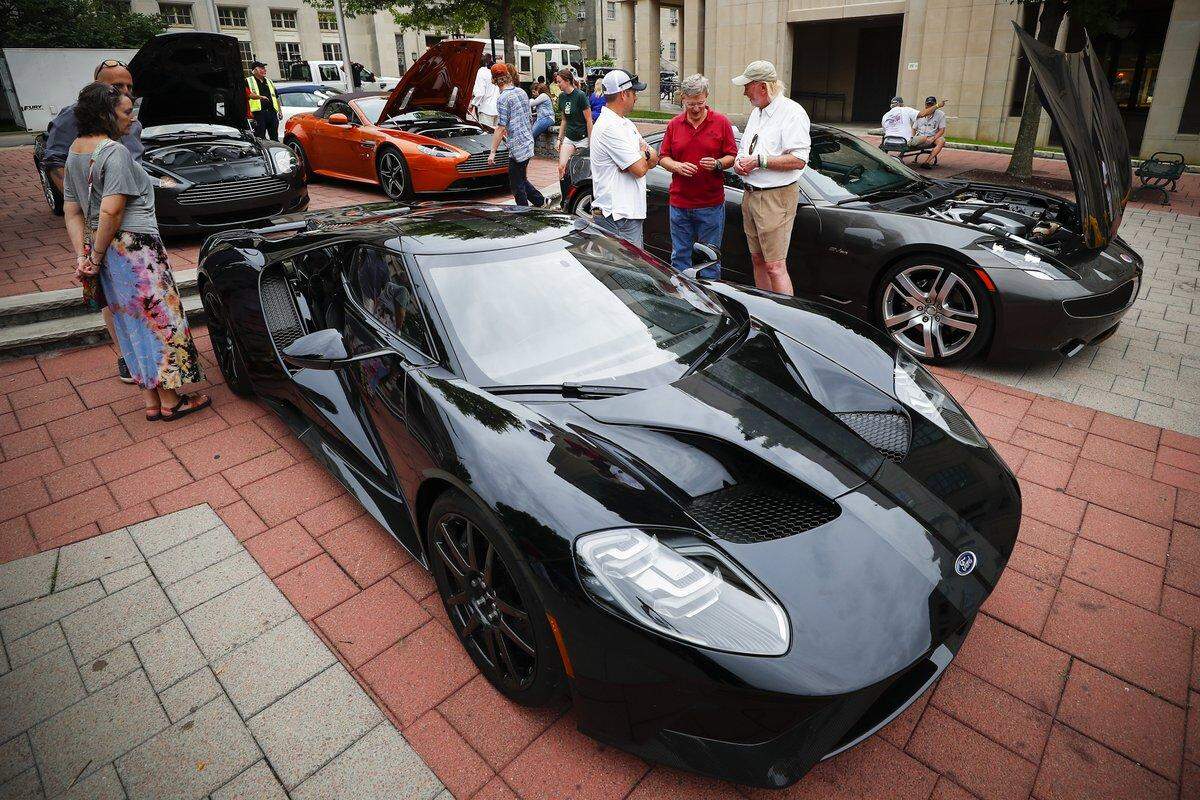 Hundreds of people gather in downtown Lexington, Ky., Friday, June 21, 2019, for the Maserati Mingle.