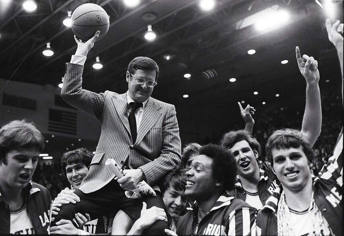 Kentucky basketball coach Joe B. Hall was carried off the floor by his players after UK upset No. 1 and undefeated Indiana 92-90 in the 1975 NCAA Tournament round of eight.
