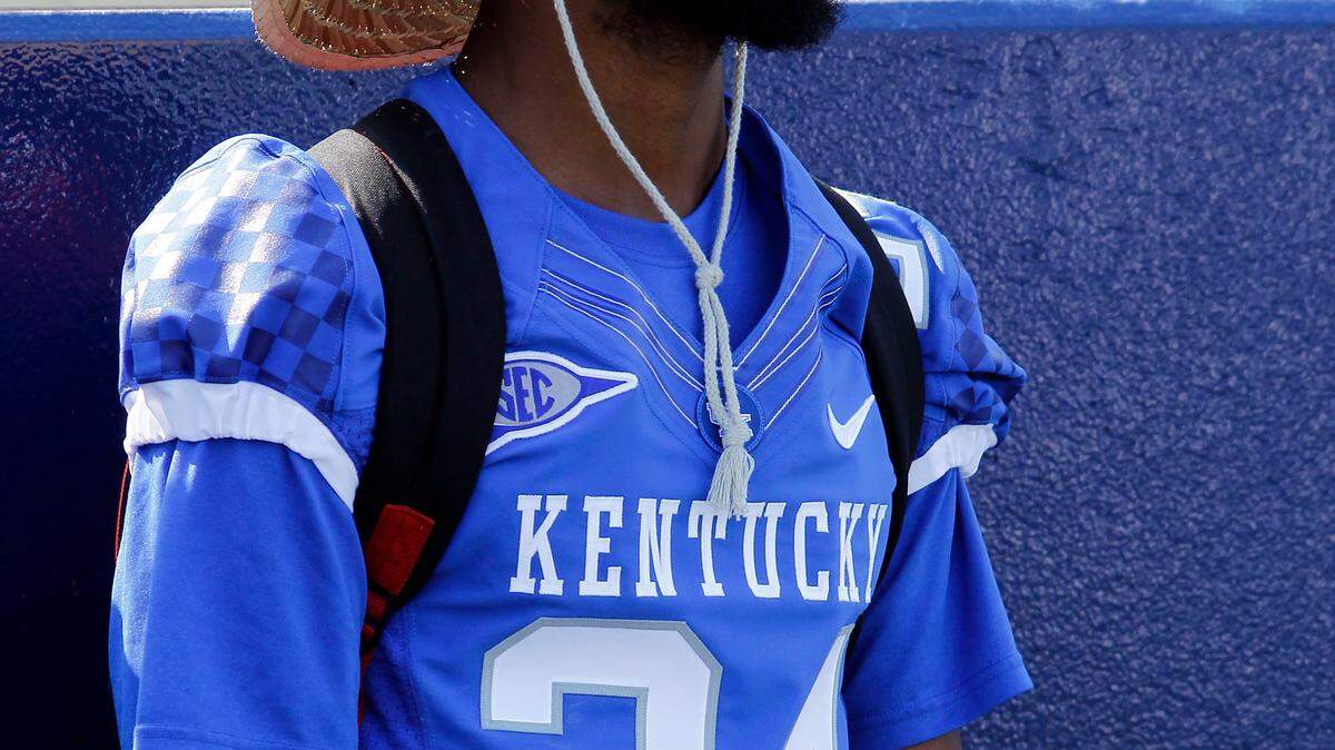 Randall Burden wore a hat for protection from the sun on a hot day recently. He'd better be just as careful if he returns punts for UK.