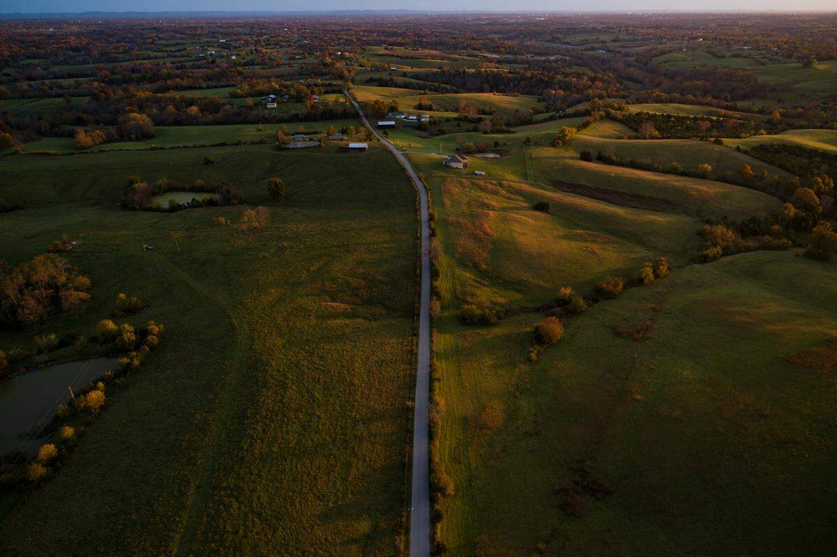The sun sets over the rolling hills Wednesday along Hackett Pike which is part of the new U.S. Bicycle Route 21 in Richmond. The new route, also called the Daniel Boone Bike Route, spans 265 miles and 10 counties through the Commonwealth, much of it along the historic trail blazed by Daniel Boone in the 1770s.