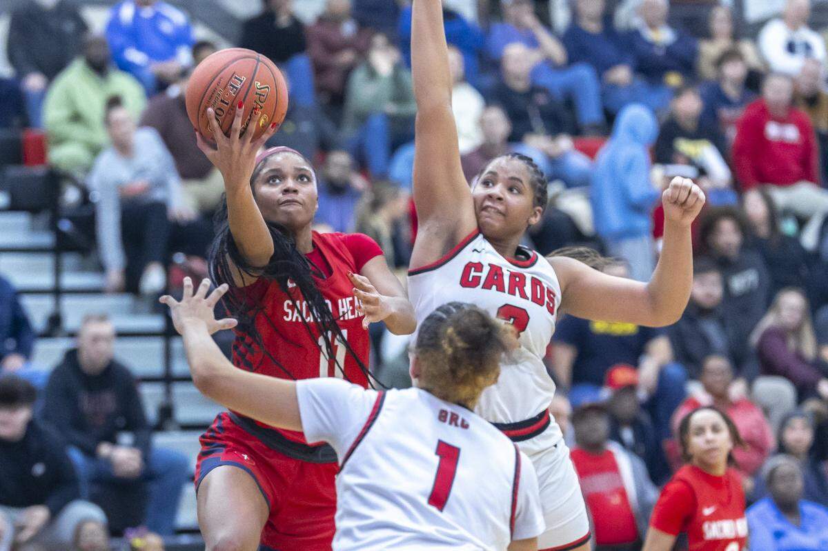 ZaKiyah Johnson (11) of Sacred Heart and Ciara Byars (3) of George Rogers Clark are the highest-rated high school recruits in Kentucky, and both made it to this week’s Sweet 16. Johnson has committed to LSU, and Clark will play for Michigan.