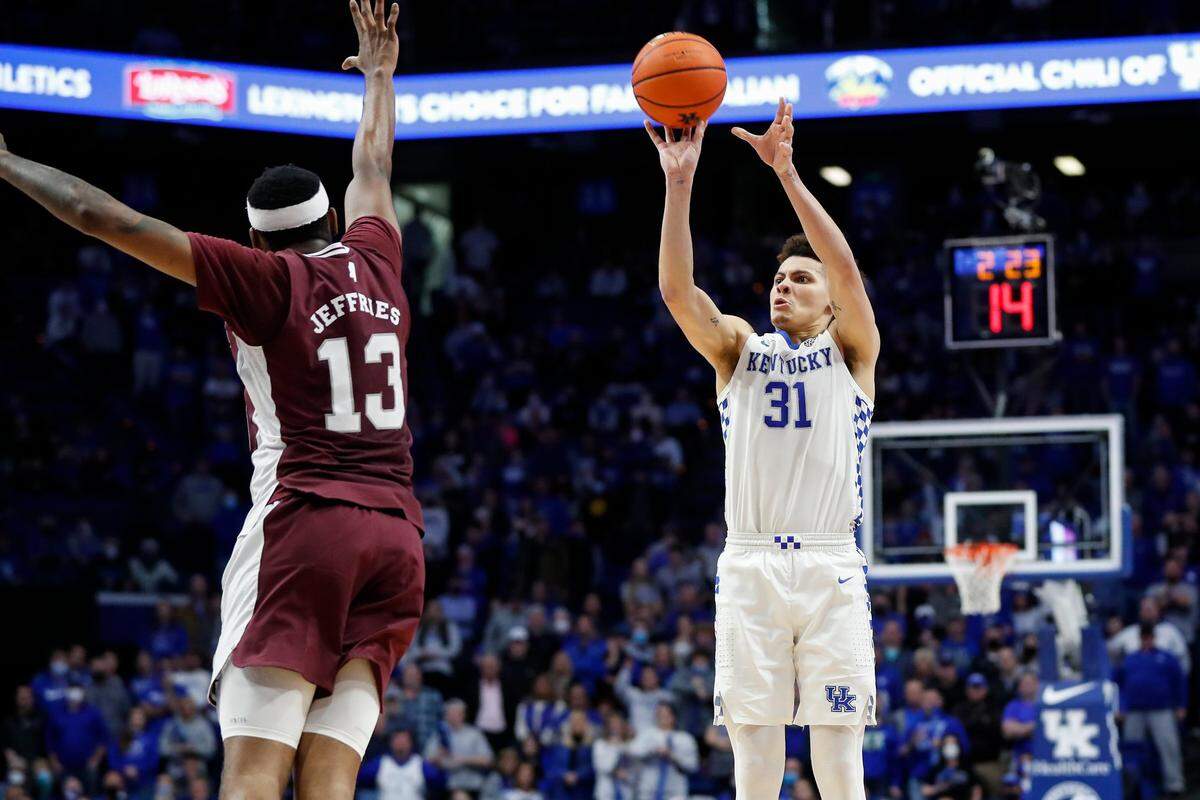 Kentucky’s Kellan Grady (31) hits a three-pointer while guarded by Mississippi State’s D.J. Jeffries (13) to give the Cats the advantage in overtime Tuesday.