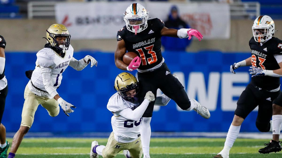 Frederick Douglass’s Ty Bryant (13) runs the ball against Bowling Green during the Class 5A state championship game at Kroger Field on Dec. 2.