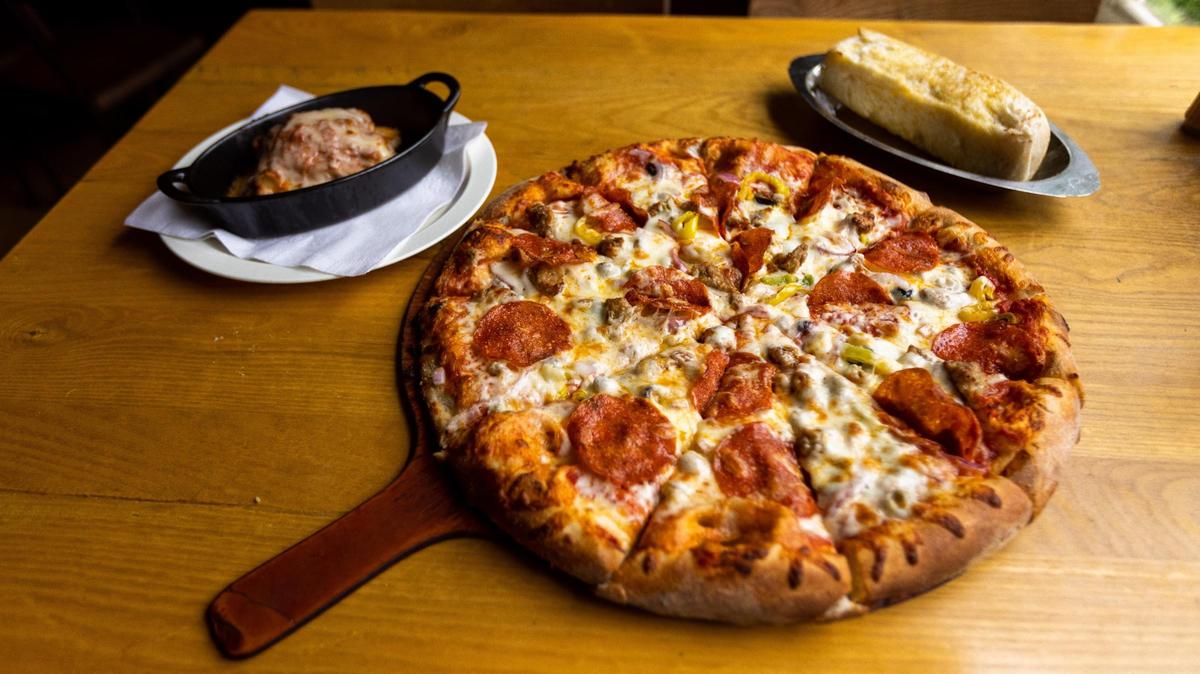 Lasagna, garlic bread, and The Mountaineer pizza from PapaLeno’s in Berea. The homemade pasta, pizza and bread stick are popular menu items from the Madison Co. restaurant.