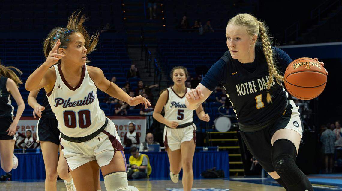 Notre Dame's Amelia Stallard moves the ball past Pikeville's Kylie Alvin during the 2026 Clark's Pump-N-Shop Girls' Basketball Sweet 16 state tournament first-round game between Pikeville and Notre Dame at Rupp Arena on March 11, 2026, in Lexington, Kentucky.