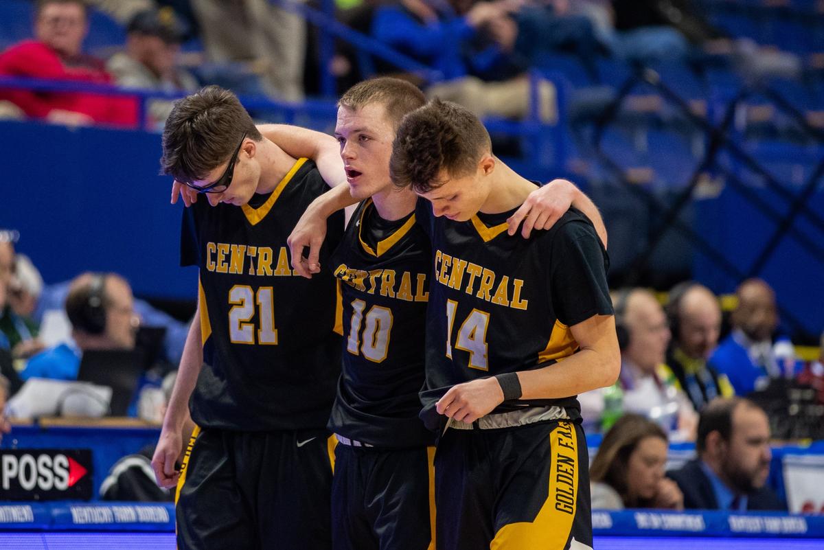 Johnson Central’s Gabe Ferrell (21), Jacob Rice (10) and Braxton Bentley (14) left the game as Trinity pulled away Wednesday.