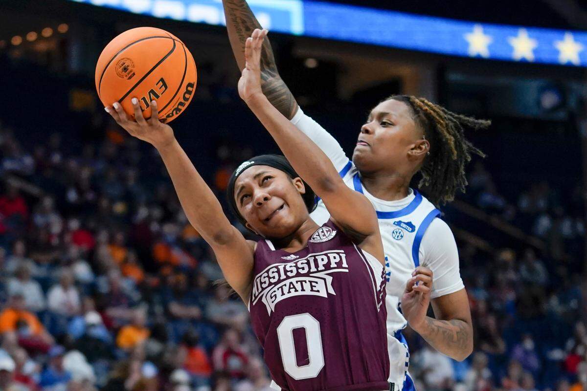 Kentucky’s Jazmine Massengill tries to block a shot by Mississippi State’s Anastasia Hayes during Thursday night’s SEC Tournament matchup in Nashville.