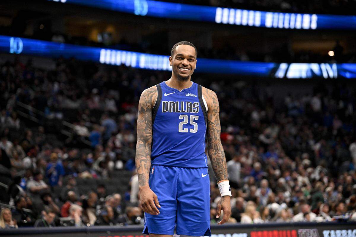 Mar 21, 2025; Dallas, Texas, USA; Dallas Mavericks forward P.J. Washington (25) smiles for the fans during the second half of the game against the Detroit Pistons at the American Airlines Center. Mandatory Credit: Jerome Miron-Imagn Images