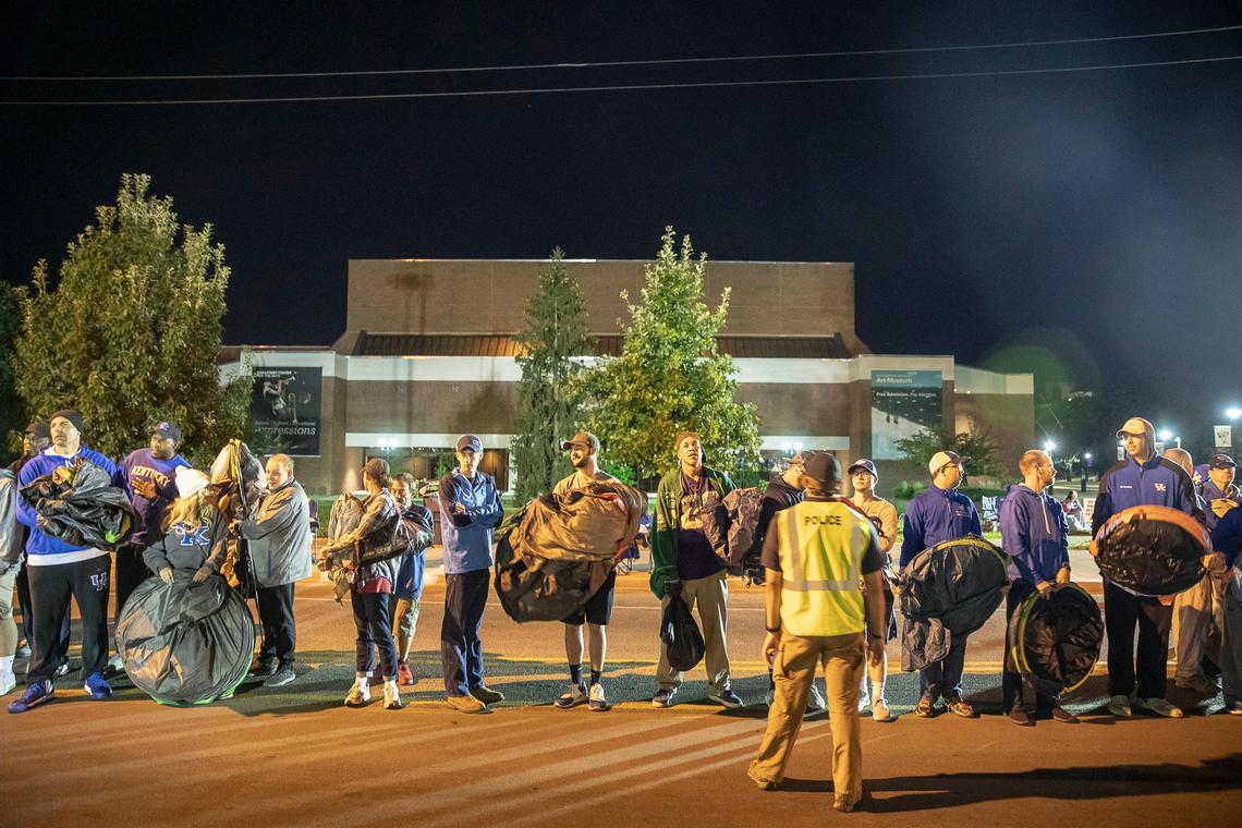 Hundreds of Kentucky basketball fans wait to cross Avenue of Champions to set up tents outside Memorial Coliseum for the most recent Big Blue Madness campout in 2019. After a two-year hiatus, the tradition returns next month.