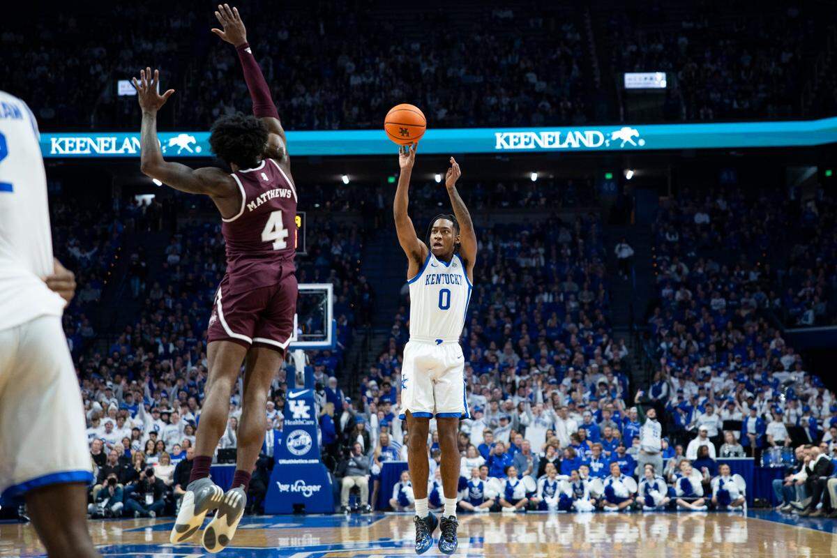 Kentucky Wildcats guard Rob Dillingham (0) shoots the ball for three points against Mississippi State Bulldogs forward Cameron Matthews (4) during the game at Rupp Arena in Lexington, Ky, Wednesday, January 17, 2024.