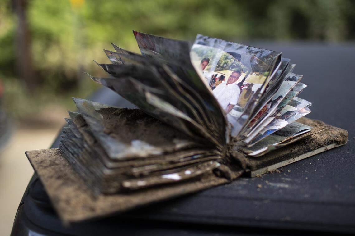 A photo album is covered in mud on Saturday, July 30, 2022.