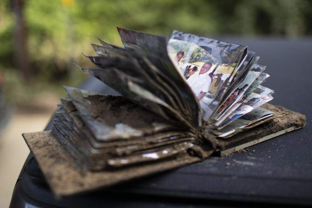 A photo album is covered in mud on Saturday, July 30, 2022.
