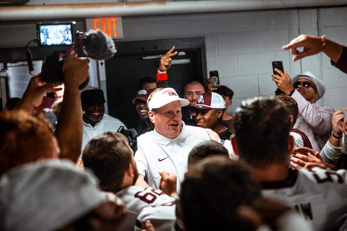 EKU football coach Walt Wells celebrates in the locker room after last Saturday’s win at Austin Peay.