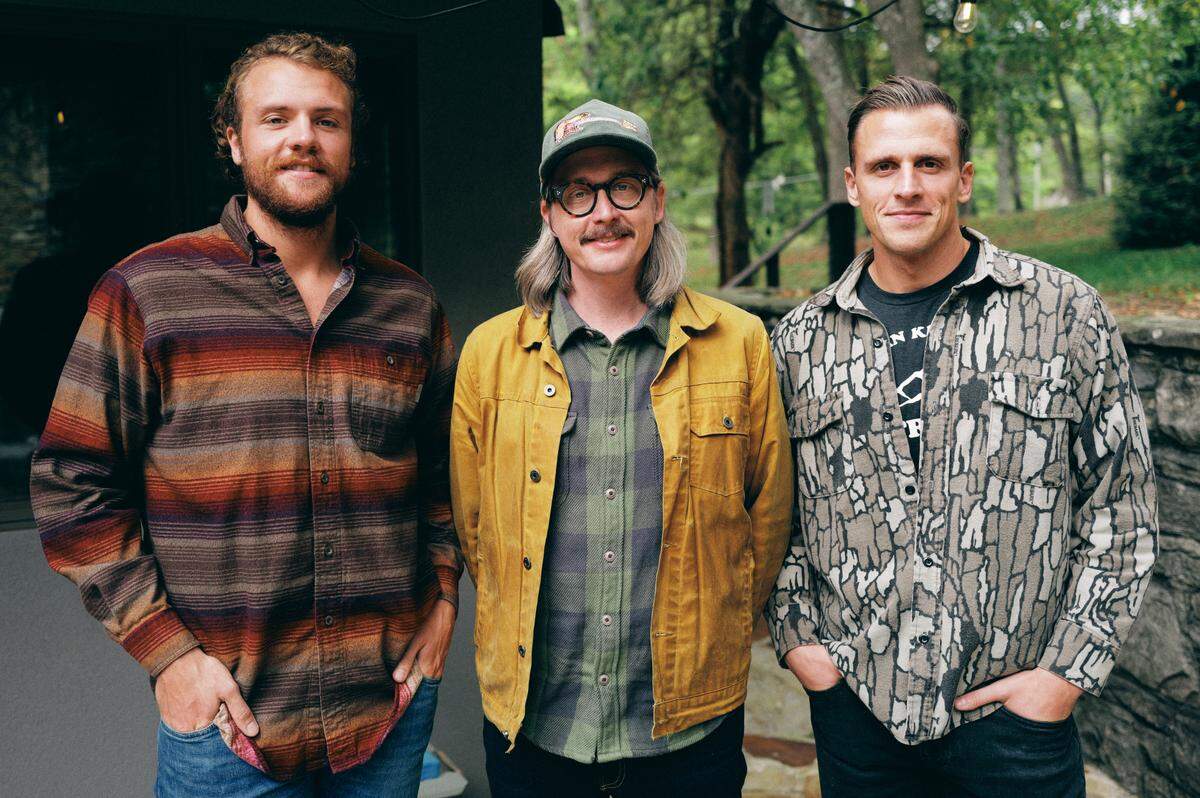 J.T. Cure with Jared and Joshua Revenscraft of New Frontier Outfitters in Morehead. The company has made corduroy hats featuring Cure’s guitar, “Purdy,” that are being sold to raise money for Chris and Morgane Stapleton’s Outlaw State of Kind non-profit.