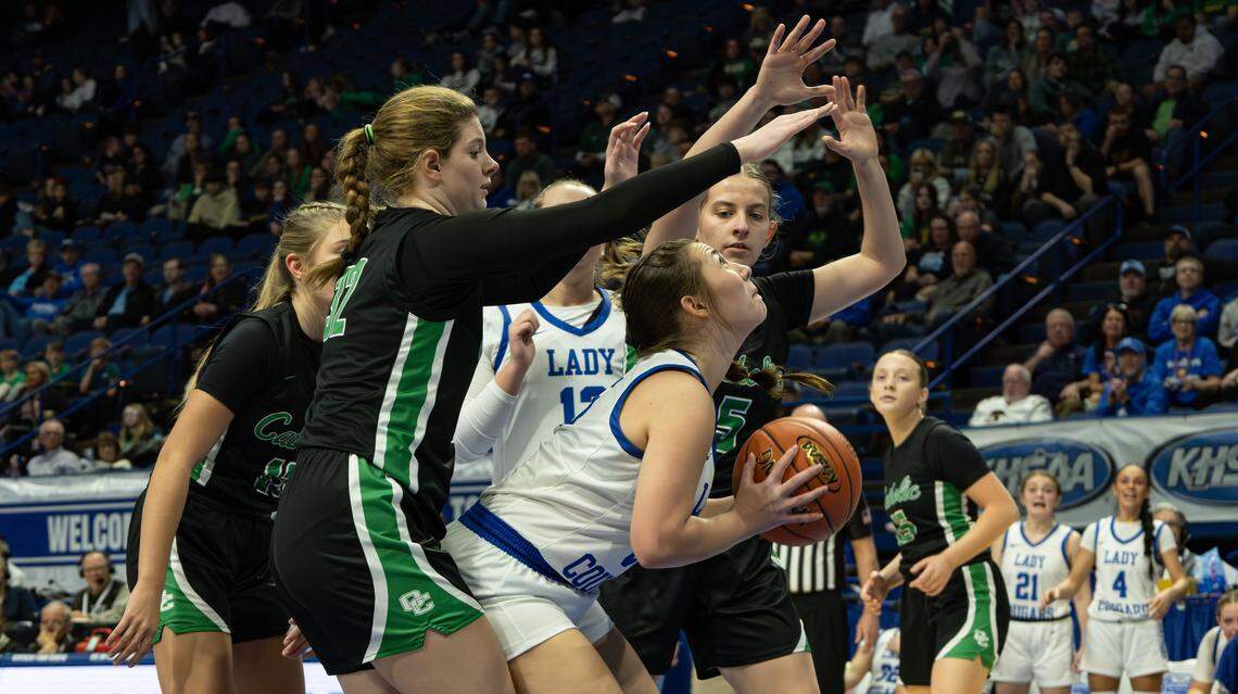 Letcher Central's Allena Tyree fights to take the two-point shot, blocked by Owensboro Catholic's defense during the 2026 Clark's Pump-N-Shop Girls' Basketball Sweet 16 state tournament first-round game between Owensboro Catholic and Letcher Central on March 12, 2026, at Rupp Arena in Lexington, Ky.