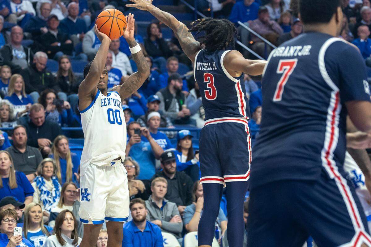Kentucky guard Otega Oweh (00) shoots the ball while defended by Jackson State guard Jayme Mitchell Jr. (3) during Friday’s game at Rupp Arena.