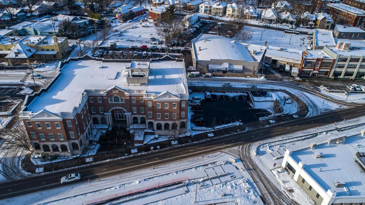 Snow covers building tops and parking lots in downtown Lexington, Ky., on Thursday, Jan. 20, 2022.