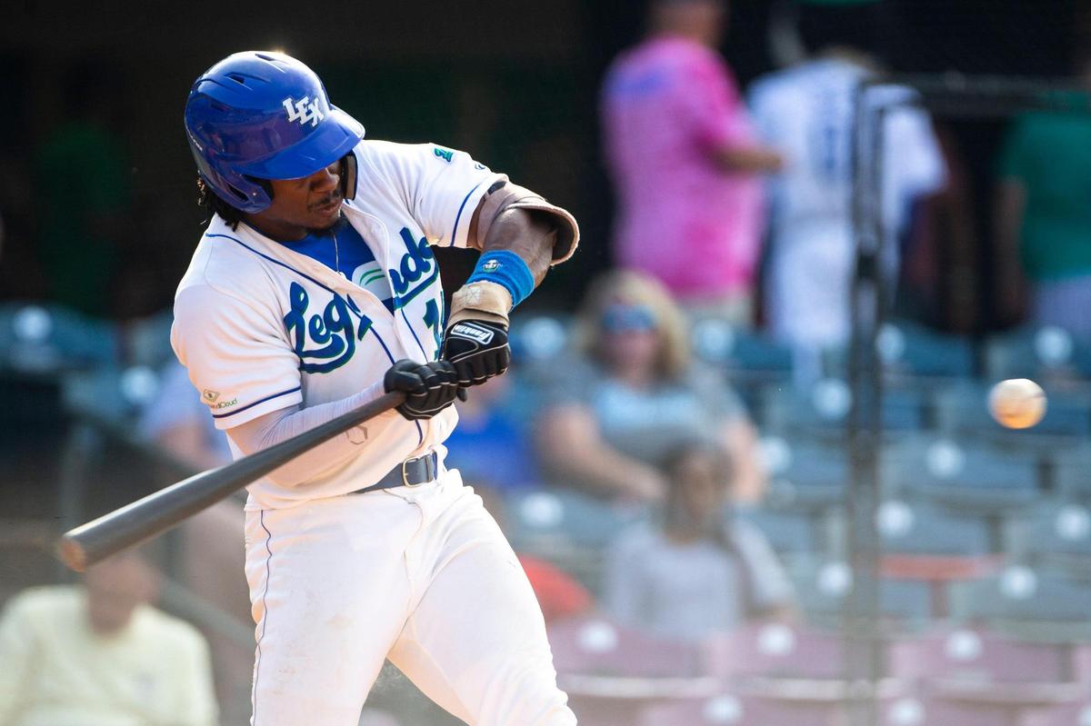 Lexington’s Tillman Pugh (15) hits a two-run home run against the Lancaster Barnstormers during a recent game. The experimental rule that moves the pitcher farther from the batter is designed to gather data for Major League Baseball about which player gains the greater advantage.