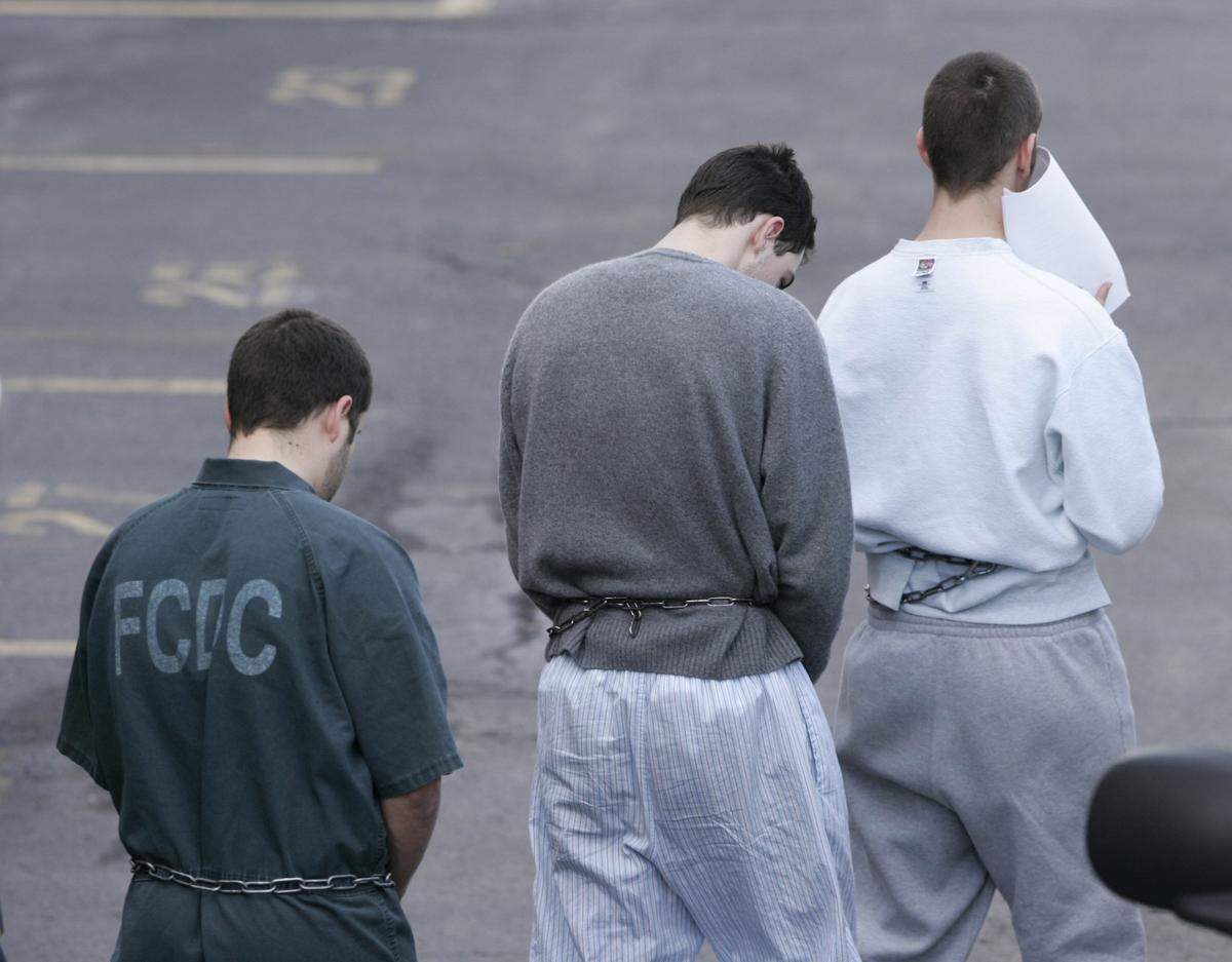 Eric Joseph Borsuk, 20, left, Charles Thomas Allen II, and Spencer Wilson  Reinhard, right, three of four 20-year-olds involved in the Transylvania University book theft, were transported from federal arraignment in Lexington,  Ky., on Feb. 11, 2015.