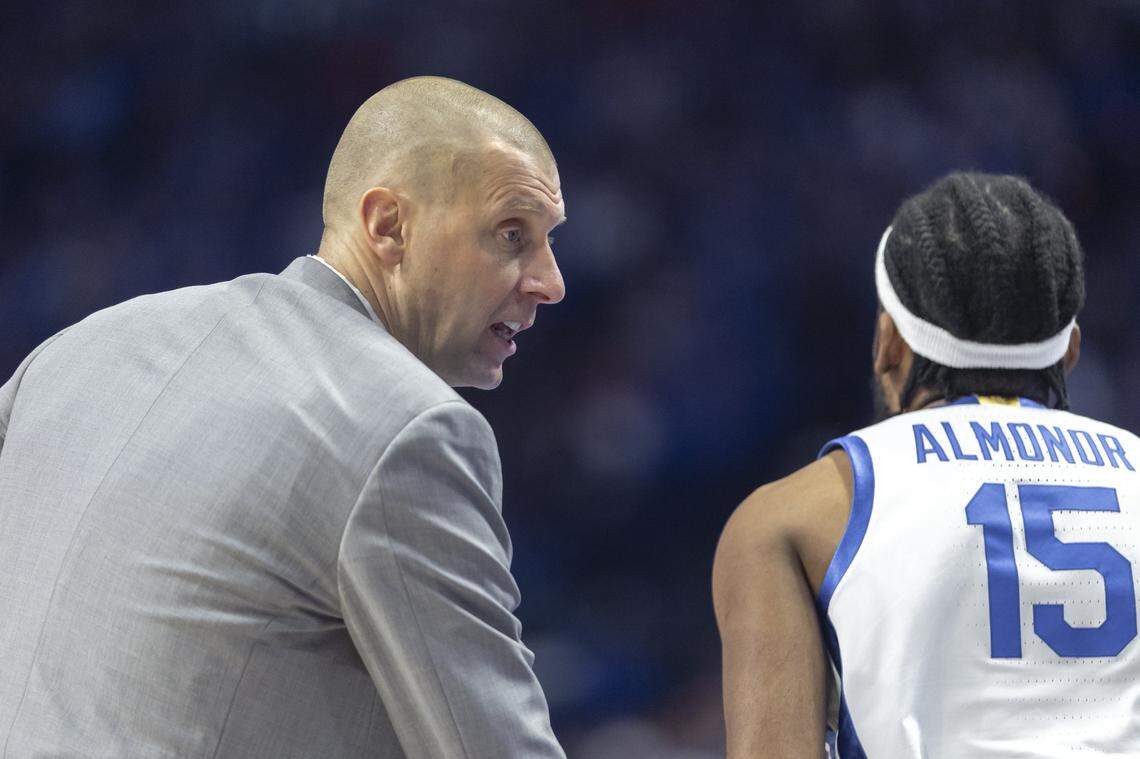 Kentucky head coach Mark Pope talks to forward Ansley Almonor during Saturday’s game against Auburn at Rupp Arena.