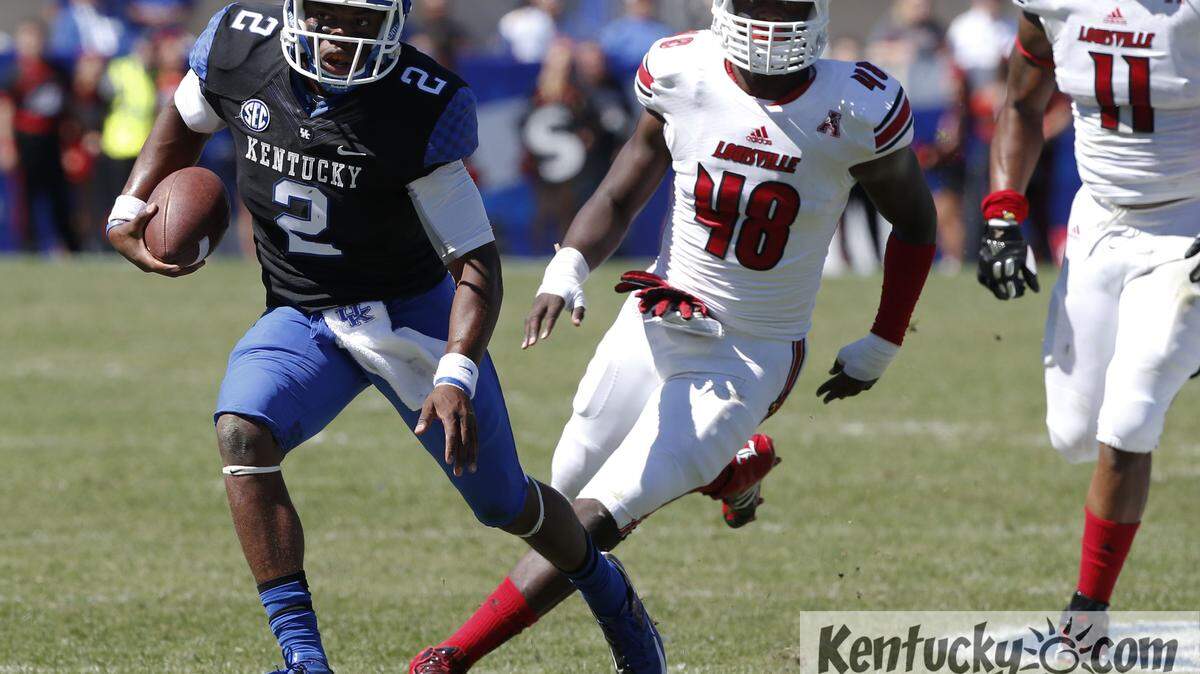 Kentucky Wildcats quarterback Jalen Whitlow #2, ran for a first down on fourth down in the fourth quarter as Louisville defeated Kentucky 27-13 on Saturday September 14, 2013 in Lexington, Ky. Photos by Mark Cornelison | Staff