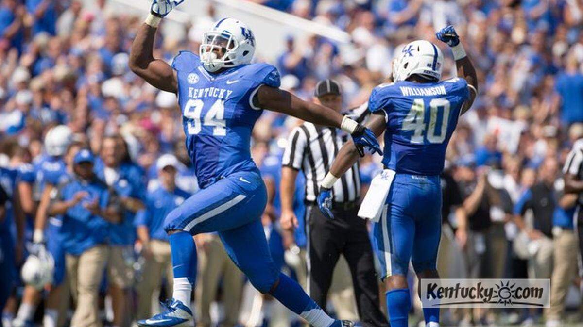 UK defensive end Za'Darius Smith celebrates after helping stop Miami (Ohio) on a third down in the first half during the University of Kentucky's home opener against Miami (Ohio) at Commonwealth Stadium in Lexington, Ky. Saturday Sept. 7, 2013.