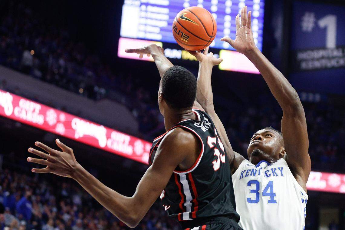 Western Kentucky Hilltoppers center Jamarion Sharp (33) blocked a shot by Kentucky star Oscar Tshiebwe (34) during UK’s 95-60 win over WKU at Rupp Arena on Dec. 22, 2021. The 7-foot-5 Sharp, a Hopkinsville product, is now playing for Mississippi.
