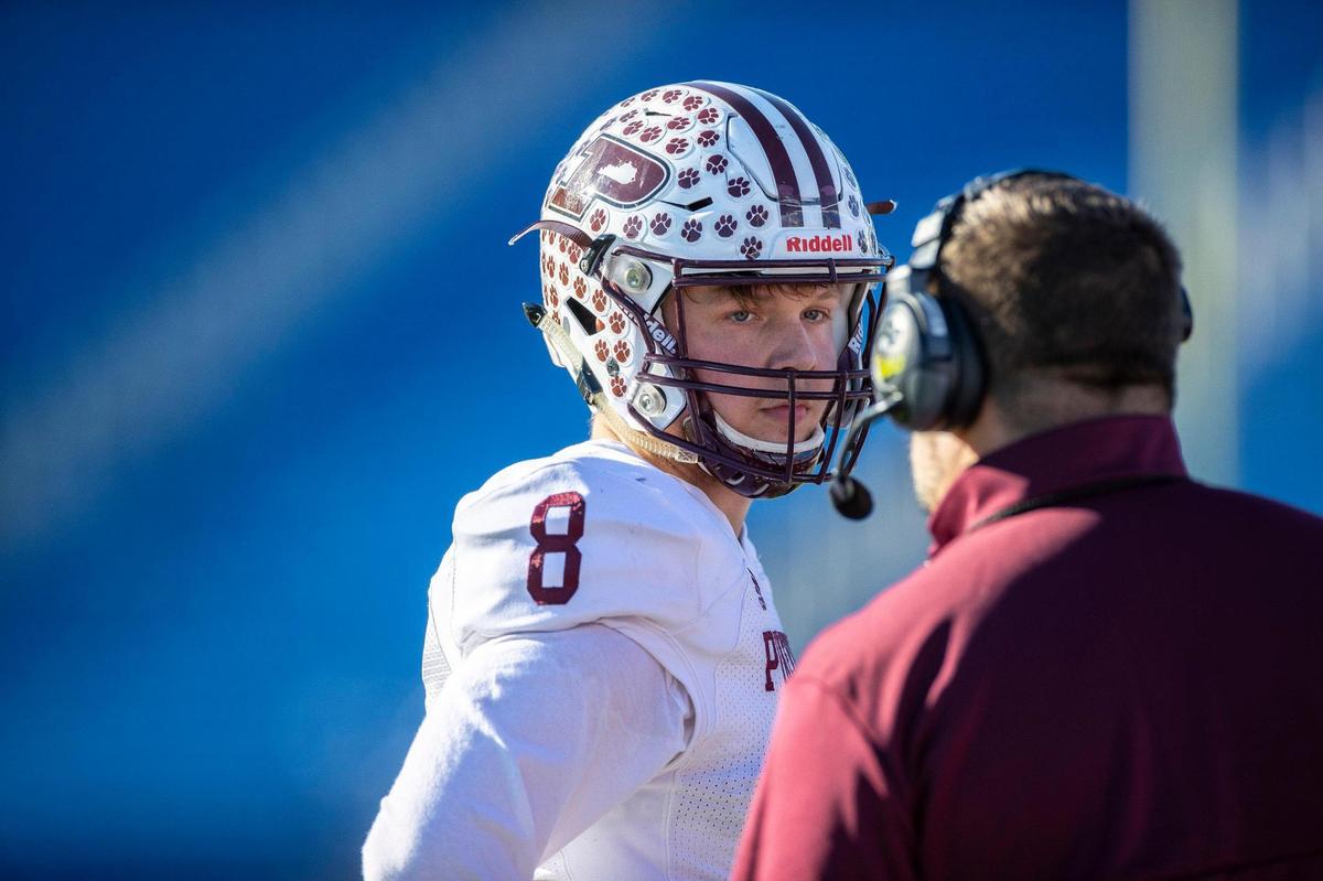 Pikeville’s Isaac McNamee (8) talks to his dad and head coach, Chris McNamee, during the Class A championship game against Russellville at Kroger Field on Dec. 3. The family duo won two state titles at Pikeville.