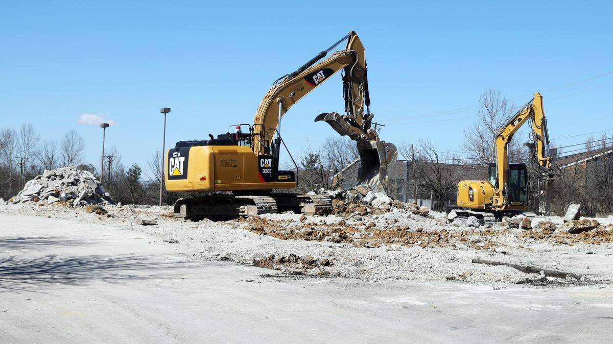 Workers with Crase Group Excavation removed what was left of Movie Tavern on Locust Hill Drive off Richmond Road Saturday. The theater closed in 2015 and the site will now be a Citadel Self Storage. photo by Brian Simms bsimms@herald-leader.com
