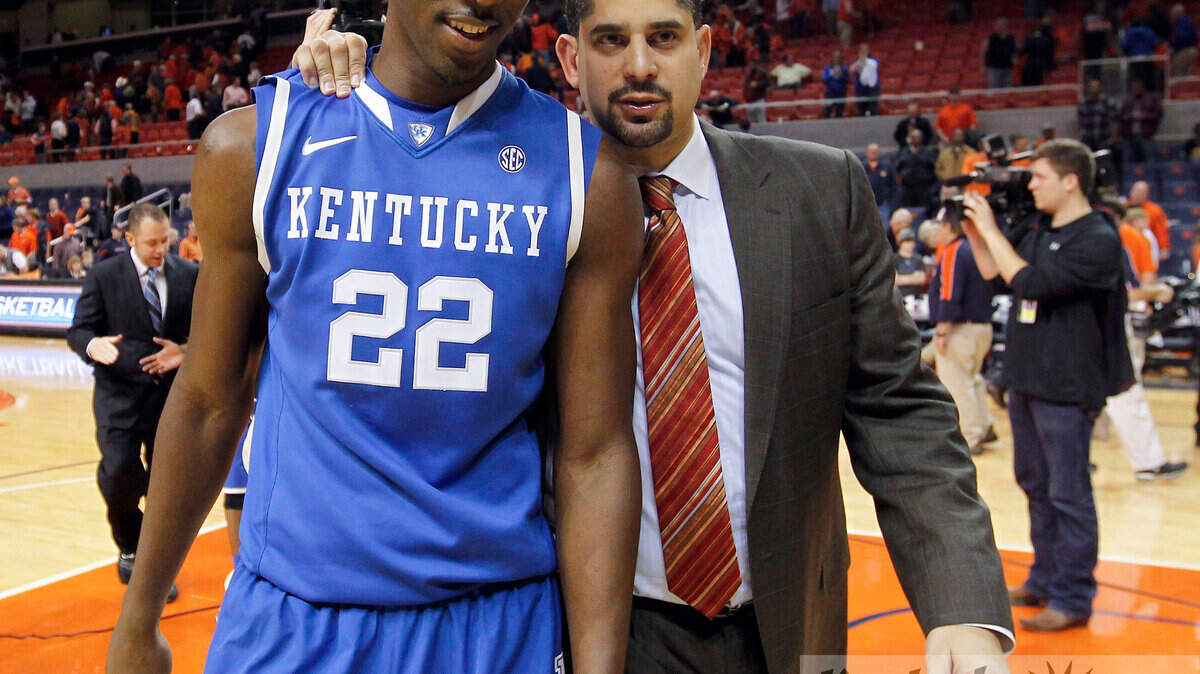 Kentucky Wildcats forward Alex Poythress (22) left the court with Assistant Coach Orlando Antigua after the University of Kentucky defeated Auburn University in the Auburn Arena in Auburn, Al., Saturday, January 19, 2013. This is second half action. UK won 75-53. Photo by Charles Bertram | Staff





