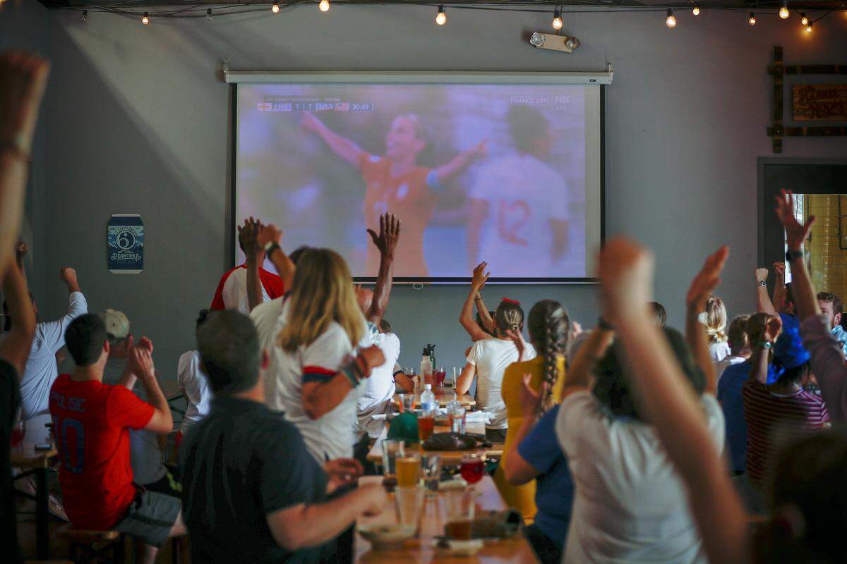 Fans cheers after a goal from United States’ Alex Morgan during a Women’s World Cup semifinal soccer match watch party at West Sixth Brewing in Lexington, Ky., Tuesday, July 2, 2019. The United States beat England 2-1.