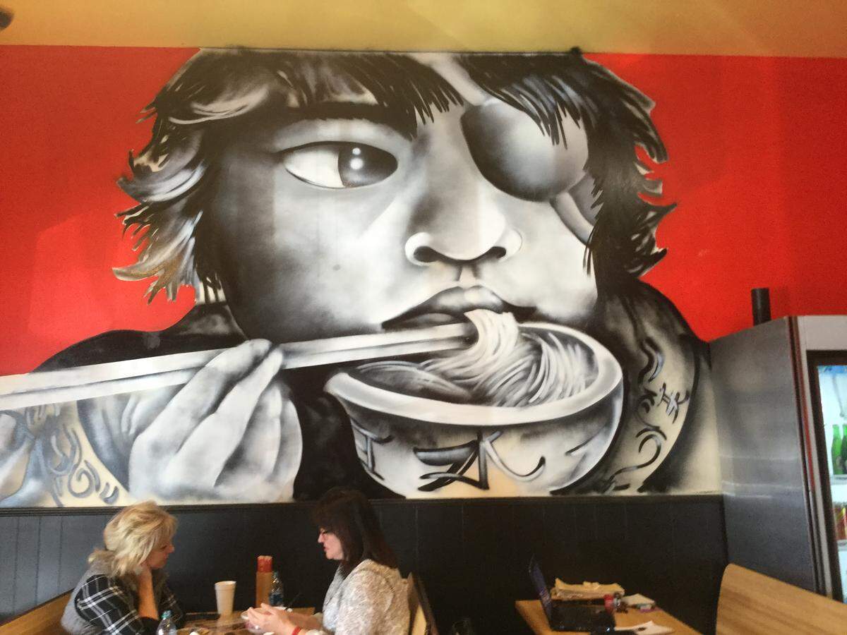 A mural by Lexington graffit artist Dani Greene is featured inside The Wok, formerly Pete’s Wok, on Waller Avenue.