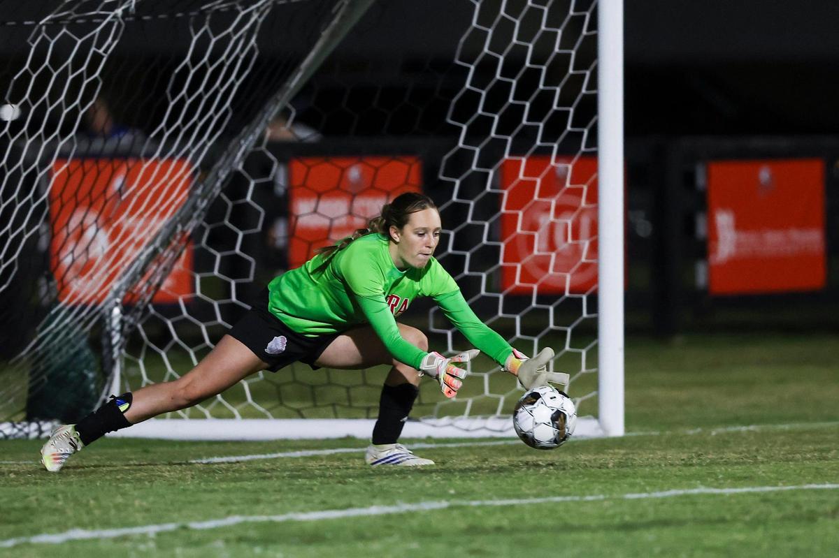 Madison Central goalkeeper Abby Moore saves a Frederick Douglass shot during Wednesday night’s win in Berea.