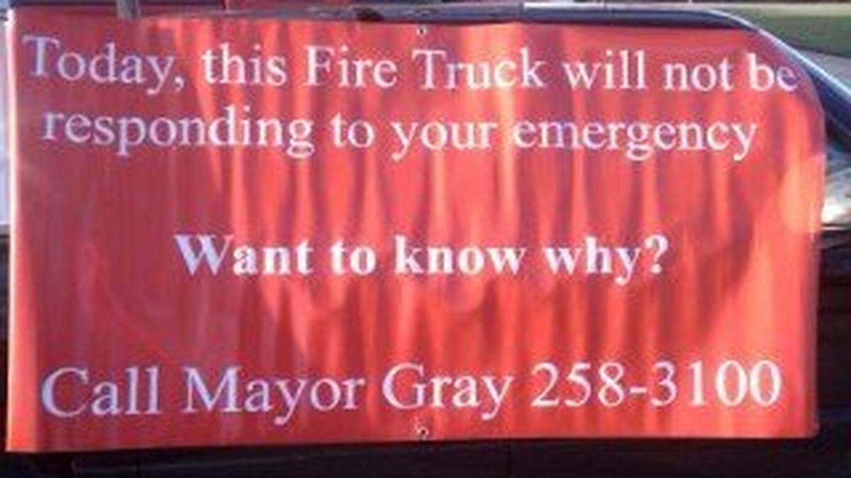 Chris Bartley, president of the Lexington firefighters' union, posted this photo to his Twitter account on Thursday night with the message, "Take a look at the new signs that will go up at fire stations when Mayor Gray Brownouts Fire Companies!!"      
